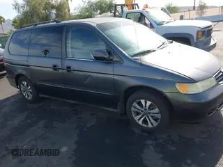 2002 Honda Odyssey EX with VIN 2HKRL18632H512158, listed as a IAAI auction lot 42354621 with 240,373 mi miles and . Bid and sale history available at DreamBid. Image 6.