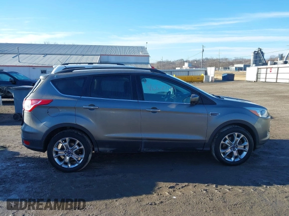 2014 Ford Escape SE z VIN 1FMCU9GXXEUB99093, wystawiony jako IAAI lot #41662040 z przebiegiem 120 783 mil mil oraz . Historia ofert i sprzedaży dostępna na DreamBid. Obrazek 14.