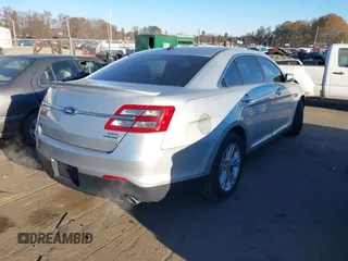 2014 Ford Taurus SEL z VIN 1FAHP2E87EG121069, wystawiony jako IAAI lot #41030422 z przebiegiem 138 043 mil mil oraz . Historia ofert i sprzedaży dostępna na DreamBid. Obrazek 4.