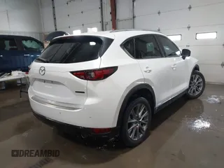 2021 Mazda CX-5 Grand Touring with VIN JM3KFADM3M0312143, listed as a IAAI auction lot 41606582 with 46,515 mi miles. Bid and sale history available at carsss.com. Image 4.