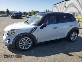 2014 MINI Countryman S with VIN WMWZC3C5XEWP25792, listed as a Copart auction lot 58583455 with 83,831 mi miles and Salvage title. Bid and sale history available at DreamBid. Image 1.