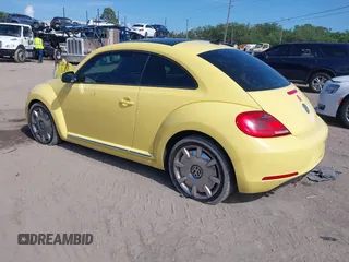 2012 Volkswagen Beetle 2.5L with VIN 3VWJX7AT9CM651806, listed as a IAAI auction lot 41912080 with 143,195 mi miles. Bid and sale history available at carsss.com. Image 3.