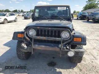 2001 Jeep Wrangler Sahara with VIN 1J4FA59S71P343366, listed as a Copart auction lot 57826405 with 156,436 mi miles and Salvage title. Bid and sale history available at DreamBid. Image 5.