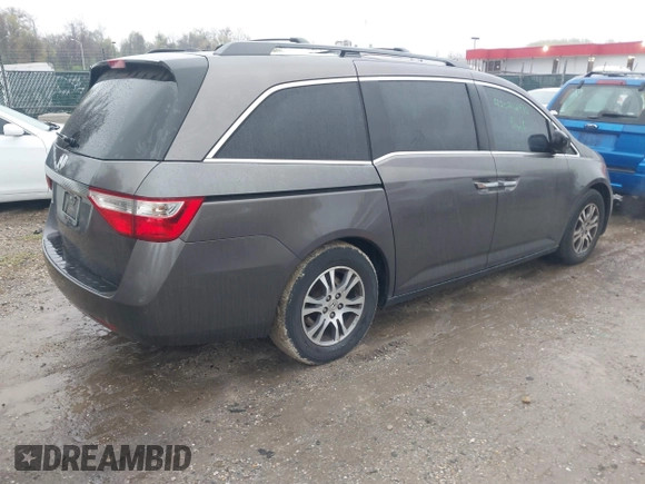 2012 Honda Odyssey EX-L with VIN 5FNRL5H6XCB057557, listed as a IAAI auction lot 42022410 with 174,286 mi miles and . Bid and sale history available at DreamBid. Image 4.