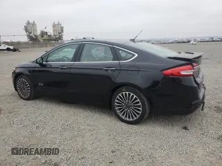 2017 Ford Fusion Titanium z VIN 3FA6P0SU5HR105415, wystawiony jako Copart lot #59779715 z przebiegiem 88 988 mil mil oraz Szkoda całkowita • Salvage title. Historia ofert i sprzedaży dostępna na DreamBid. Obrazek 2.