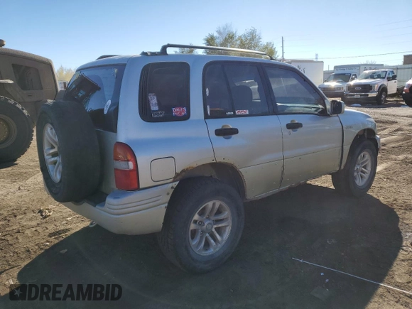 1999 Suzuki Grand Vitara JLX z VIN JS3TD62V0X4113058, wystawiony jako Copart lot #80089884 z przebiegiem 165 794 mil mil oraz Szkoda całkowita • Salvage title. Historia ofert i sprzedaży dostępna na DreamBid. Obrazek 3.
