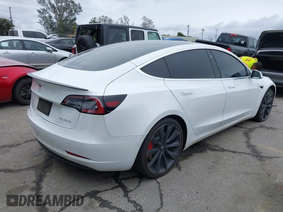 2020 Tesla Model 3 Performance z VIN 5YJ3E1EC4LF625109, wystawiony jako IAAI lot #41735149 z przebiegiem 95 010 mil mil oraz . Historia ofert i sprzedaży dostępna na DreamBid. Obrazek 4.