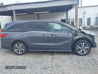 2023 Honda Odyssey Touring with VIN 5FNRL6H86PB065670, listed as a IAAI auction lot 41691093 with 22,518 mi miles and . Bid and sale history available at DreamBid. Image 14.