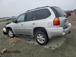 2004 GMC Envoy SLE with VIN 1GKDS13S142358446, listed as a Copart auction lot 43383935 with 154,358 mi miles and Salvage Title. Bid and sale history available at carsss.com. Image 2.