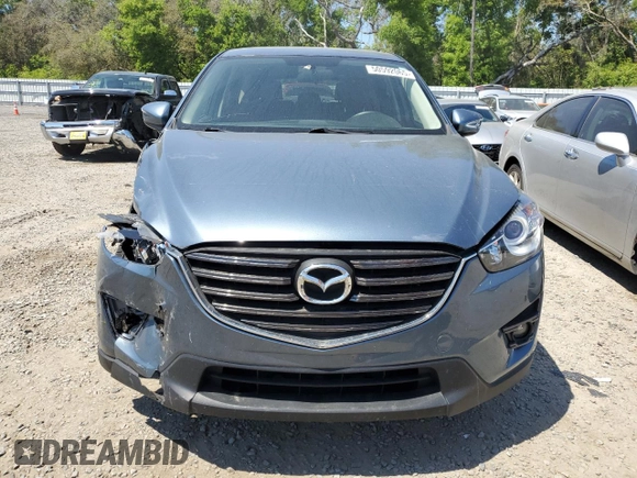 2016 Mazda CX-5 Touring with VIN JM3KE2CY0G0894283, listed as a Copart auction lot 50592065 with 86,400 mi miles and Salvage Title. Bid and sale history available at carsss.com. Image 5.