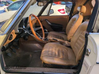 1982 Alfa Romeo Spider Veloce z VIN ZARBA5414C1014655, wystawiony jako Copart lot #74420044 z przebiegiem 63 266 mil mil oraz Szkody całkowita. Historia ofert i sprzedaży dostępna na DreamBid. Obrazek 7.