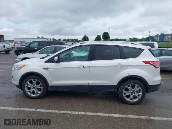 2016 Ford Escape Titanium with VIN 1FMCU9JX4GUB72080, listed as a IAAI auction lot 42519240 with 121,793 mi miles and . Bid and sale history available at DreamBid. Image 14.