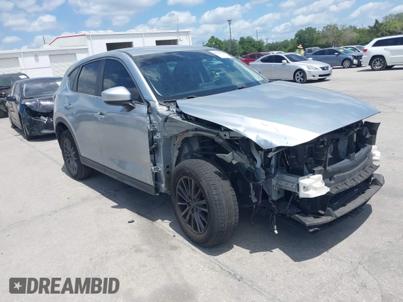 2017 Mazda CX-5 Sport with VIN JM3KFABLXH0135560, listed as a IAAI auction lot 42062016 with 153,416 mi miles. Bid and sale history available at carsss.com. Image 1.