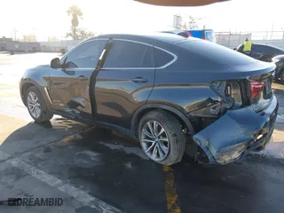 2019 BMW X6 sDrive35i with VIN 5UXKU0C57K0S97581, listed as a IAAI auction lot 41322568 with 76,635 mi miles. Bid and sale history available at carsss.com. Image 3.