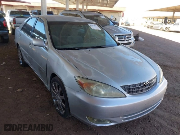 2003 Toyota Camry LE with VIN JTDBE32K730176610, listed as a IAAI auction lot 41627010 with 238,502 mi miles and . Bid and sale history available at DreamBid. Image 1.