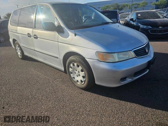 2001 Honda Odyssey LX with VIN 2HKRL18501H617598, listed as a Copart auction lot 65471805 with 125,298 mi miles and Clean title. Bid and sale history available at DreamBid. Image 4.