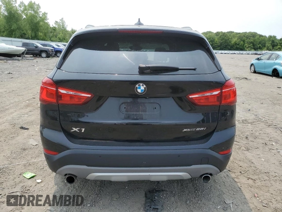 2018 BMW X1 xDrive28i with VIN WBXHT3C36J3H29952, listed as a Copart auction lot 59679285 with 75,220 mi miles and Salvage title. Bid and sale history available at DreamBid. Image 6.
