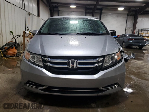 2016 Honda Odyssey SE with VIN 5FNRL5H31GB109718, listed as a Copart auction lot 54689915 with 48,933 mi miles and Salvage Title. Bid and sale history available at DreamBid. Image 5.