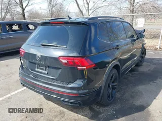 2023 Volkswagen Tiguan SE R-Line Black with VIN 3VVCB7AXXPM094621, listed as a IAAI auction lot 41737103 with 21,069 mi miles and . Bid and sale history available at DreamBid. Image 4.