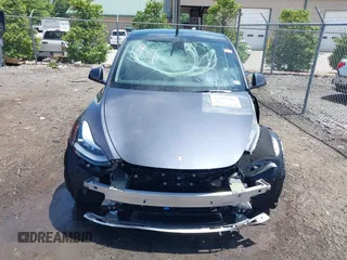 2023 Tesla Model Y Long Range with VIN 7SAYGAEE7PF615751, listed as a IAAI auction lot 42297819 with 31,201 mi miles and . Bid and sale history available at DreamBid. Image 13.