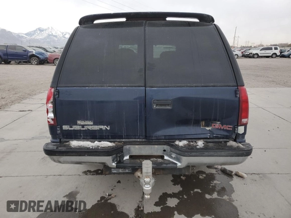 1999 GMC Suburban z VIN 1GDFK16R9XJ771458, wystawiony jako Copart lot #43412175 z przebiegiem 159 328 mil mil oraz Szkody całkowita. Historia ofert i sprzedaży dostępna na DreamBid. Obrazek 6.