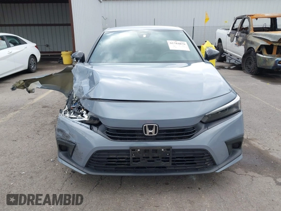 2022 Honda Civic Sport z VIN 2HGFE2F58NH569211, wystawiony jako IAAI lot #41784870 z przebiegiem 22 255 mil mil oraz . Historia ofert i sprzedaży dostępna na DreamBid. Obrazek 12.