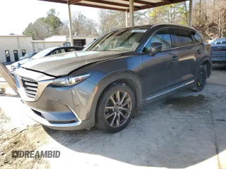 2018 Mazda CX-9 Grand Touring z VIN JM3TCADY6J0210136, wystawiony jako Copart lot #43649245 z przebiegiem 145 921 mil mil oraz Czysty tytuł • Clean title. Historia ofert i sprzedaży dostępna na DreamBid. Obrazek 1.
