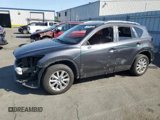 2016 Mazda CX-5 Touring z VIN JM3KE2CY3G0845305, wystawiony jako Copart lot #59959885 z przebiegiem 136 770 mil mil oraz Szkoda całkowita • Salvage title. Historia ofert i sprzedaży dostępna na DreamBid. Obrazek 1.