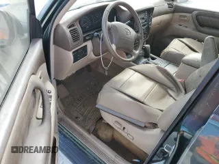 1999 Toyota Land Cruiser with VIN JT3HT05J9X0027448, listed as a Copart auction lot 77175814 with 0 mi miles and Salvage Title. Bid and sale history available at carsss.com. Image 8.