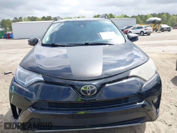2018 Toyota RAV4 XLE with VIN 2T3RFREV1JW697044, listed as a IAAI auction lot 41891412 with 140,145 mi miles. Bid and sale history available at carsss.com. Image 13.