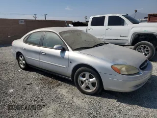 2002 Ford Taurus SE with VIN 1FAFP53272G198088, listed as a Copart auction lot 69810014 with 152,794 mi miles and Clean title. Bid and sale history available at DreamBid. Image 4.