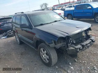 2009 Jeep Grand Cherokee Laredo with VIN 1J8GS48K59C548330, listed as a IAAI auction lot 41887548 with 184,434 mi miles. Bid and sale history available at carsss.com. Image 1.