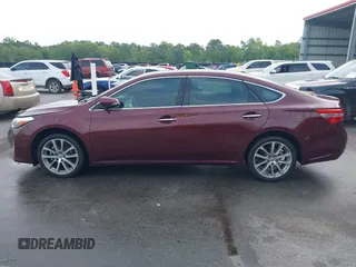 2014 Toyota Avalon Limited with VIN 4T1BK1EB3EU113035, listed as a IAAI auction lot 42040239 with 118,609 mi miles. Bid and sale history available at carsss.com. Image 13.