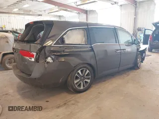 2014 Honda Odyssey Touring with VIN 5FNRL5H99EB105059, listed as a IAAI auction lot 42457672 with 240,581 mi miles and . Bid and sale history available at DreamBid. Image 4.