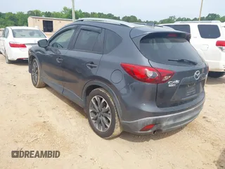 2016 Mazda CX-5 Grand Touring z VIN JM3KE2DY5G0801238, wystawiony jako IAAI lot #42264694 z przebiegiem 136 993 mil mil oraz . Historia ofert i sprzedaży dostępna na DreamBid. Obrazek 3.