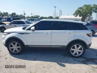2015 Land Rover Range Rover Evoque Pure Premium z VIN SALVR2BG0FH964683, wystawiony jako IAAI lot #42016766 z przebiegiem 94 942 mil mil oraz . Historia ofert i sprzedaży dostępna na DreamBid. Obrazek 14.