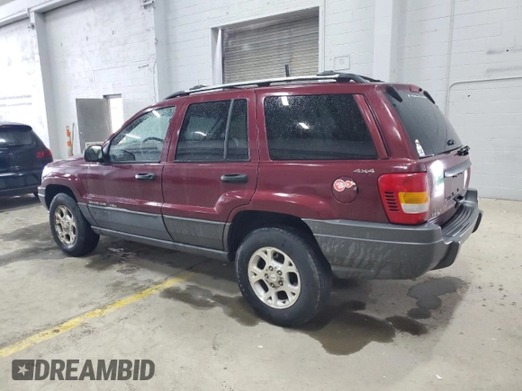 2001 Jeep Grand Cherokee Laredo with VIN 1J4GW48S11C618478, listed as a Copart auction lot 57889965 with Not provided miles and Clean title. Bid and sale history available at DreamBid. Image 2.