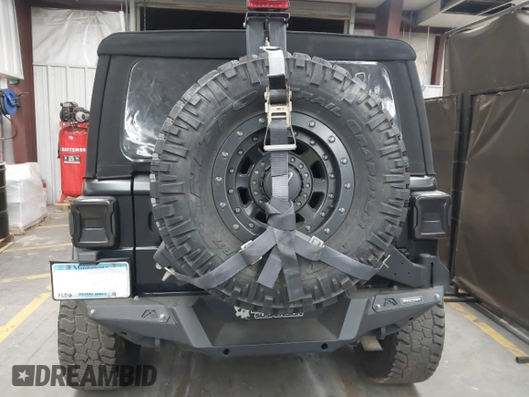 2018 Jeep Wrangler Unlimited Sahara z VIN 1C4HJXEN6JW294774, wystawiony jako IAAI lot #41573606 z przebiegiem 49 325 mil mil oraz . Historia ofert i sprzedaży dostępna na DreamBid. Obrazek 17.