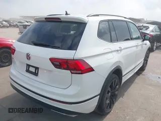 2021 Volkswagen Tiguan SE with VIN 3VV3B7AX9MM003432, listed as a IAAI auction lot 41914477 with 64,530 mi miles and . Bid and sale history available at DreamBid. Image 4.
