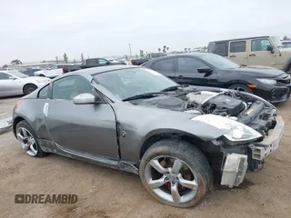 2006 Nissan 350Z Touring z VIN JN1AZ34D86M312841, wystawiony jako IAAI lot #42336869 z przebiegiem 138 191 mil mil oraz . Historia ofert i sprzedaży dostępna na DreamBid. Obrazek 6.