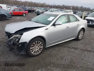 2012 Cadillac CTS z VIN 1G6DA5E50C0152626, wystawiony jako IAAI lot #41101077 z przebiegiem 104 324 mil mil oraz . Historia ofert i sprzedaży dostępna na DreamBid. Obrazek 2.