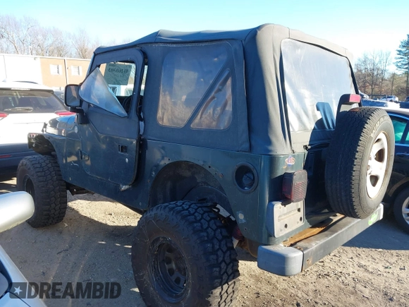 2005 Jeep Wrangler SE with VIN 1J4FA29155P366432, listed as a IAAI auction lot 41260303 with 134,021 mi miles. Bid and sale history available at carsss.com. Image 3.