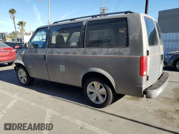 1992 Chevrolet Astro with VIN 1GNDM19Z3NB219051, listed as a Copart auction lot 41997675 with 242,745 mi miles and Salvage Title. Bid and sale history available at carsss.com. Image 2.