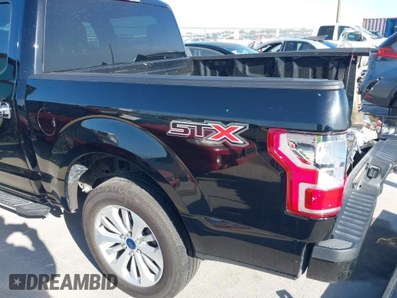 2018 Ford F-150 XL with VIN 1FTEW1C58JKC02382, listed as a IAAI auction lot 42010568 with 124,757 mi miles and . Bid and sale history available at DreamBid. Image 19.
