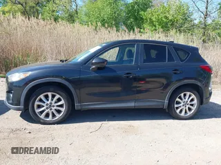2013 Mazda CX-5 Grand Touring with VIN JM3KE4DE6D0127601, listed as a IAAI auction lot 42143558 with 95,719 mi miles and . Bid and sale history available at DreamBid. Image 14.