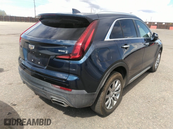 2021 Cadillac XT4 FWD Premium Luxury with VIN 1GYFZCR48MF004009, listed as a IAAI auction lot 41956723 with 82,483 mi miles. Bid and sale history available at carsss.com. Image 4.