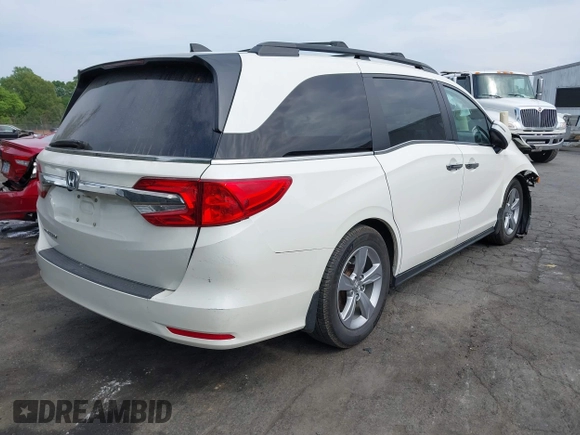 2018 Honda Odyssey EX-L with VIN 5FNRL6H77JB047919, listed as a IAAI auction lot 42112505 with 108,706 mi miles and . Bid and sale history available at DreamBid. Image 4.
