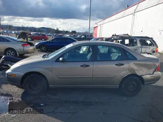 2004 Ford Focus SE with VIN 1FAFP34354W167961, listed as a IAAI auction lot 41545304 with 128,560 mi miles and . Bid and sale history available at DreamBid. Image 14.