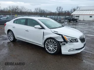 2014 Buick LaCrosse Premium II with VIN 1G4GF5G39EF305460, listed as a IAAI auction lot 41951229 with 127,188 mi miles and . Bid and sale history available at DreamBid. Image 1.
