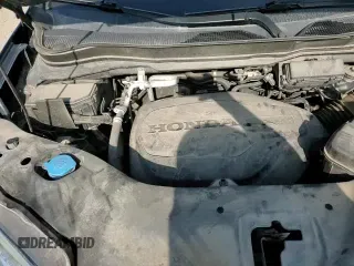 2021 Honda Pilot Elite z VIN 5FNYF6H07MB082065, wystawiony jako Copart lot #60275085 z przebiegiem 87 737 mil mil oraz Szkoda całkowita • Salvage title. Historia ofert i sprzedaży dostępna na DreamBid. Obrazek 14.